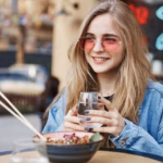 portrait-natural-woman-sunglasses-enjoying-asian-food-s_197531-31013
